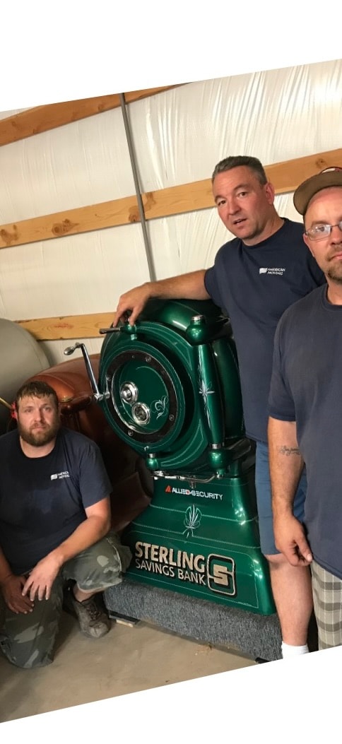 American Moving Co crew with vintage Sterling Savings Bank safe