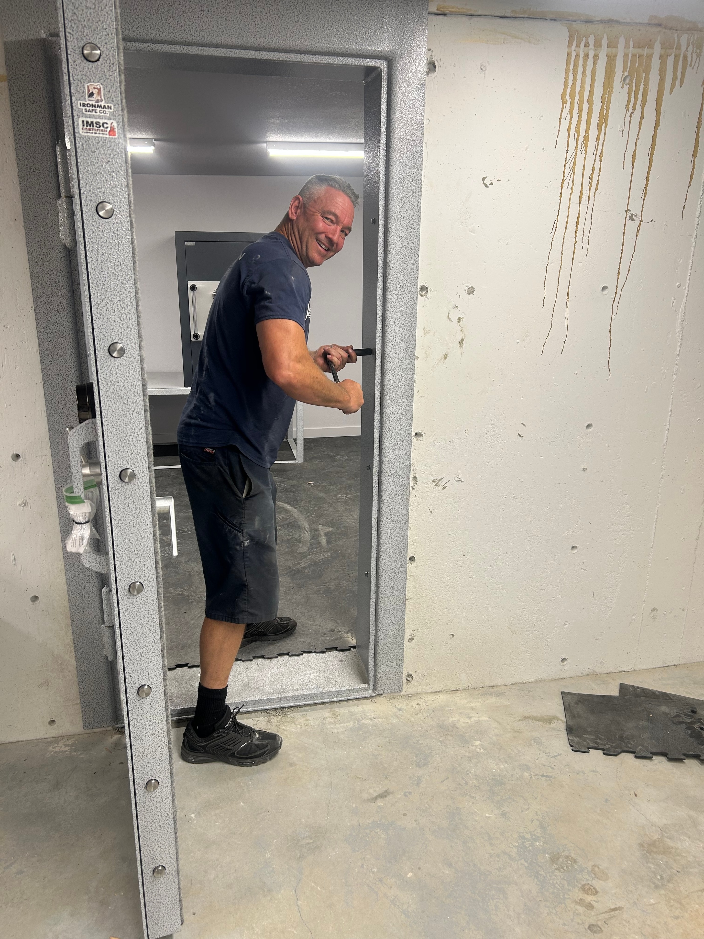 Crew member at vault door installation